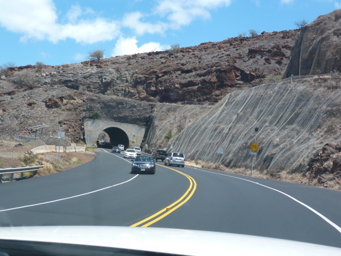 Most of the rock walls lining the highways had a sort of wire mesh anchored into them to catch falling rock...which was great since we had no roof on the car.